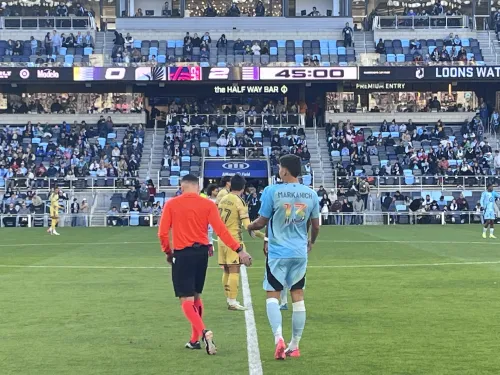 Markanich and the ref at the midline. 